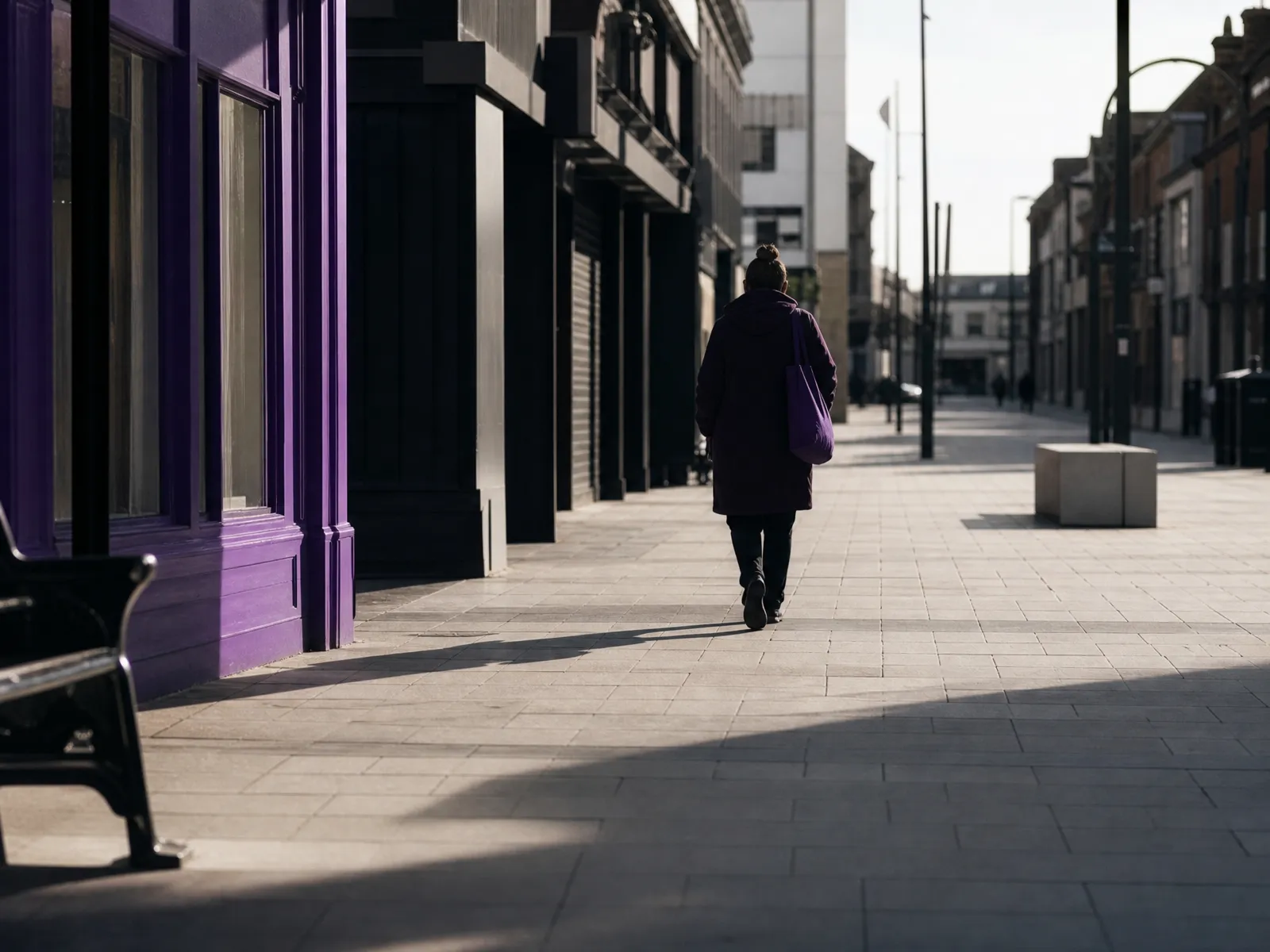 A pedestrian high street in Uxbridge receding into soft morning light